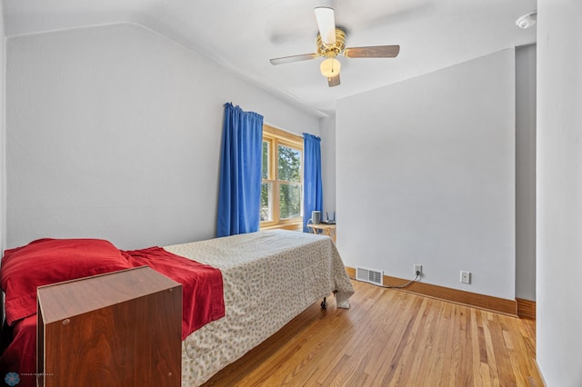 114 2nd Ave E, West Fargo, ND 58078 - bedroom with wood finished floors, baseboards, lofted ceiling, and a ceiling fan