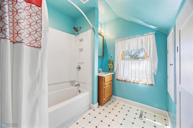 114 2nd Ave E, West Fargo, ND 58078 - bathroom with tile patterned floors, vanity, shower / tub combo, and lofted ceiling