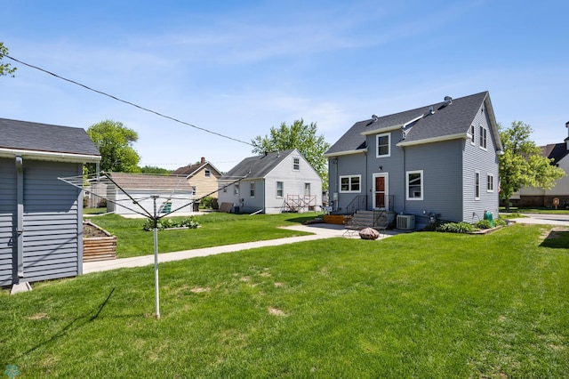 114 2nd Ave E, West Fargo, ND 58078 - back of property with a lawn and central air condition unit