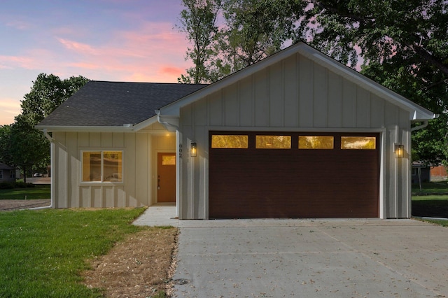 602 Freeman Ave S, Delano, MN 55328 - view of front of property featuring board and batten siding, a shingled roof, a garage, and a front yard