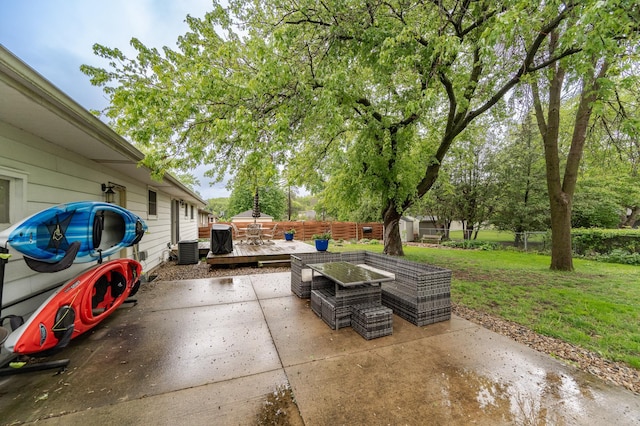 1000 17th St SW, Austin, MN 55912 - view of patio with a deck, central air condition unit, and outdoor dining space