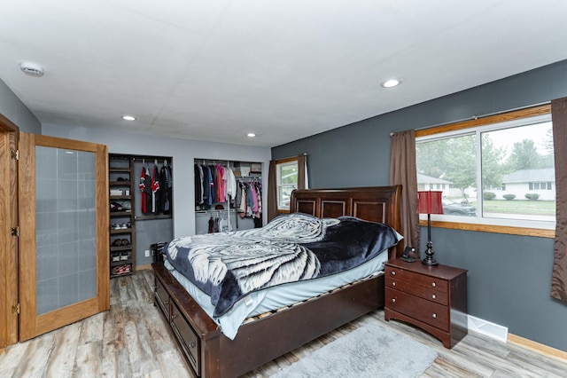 1000 17th St SW, Austin, MN 55912 - bedroom featuring wood finished floors, baseboards, and recessed lighting