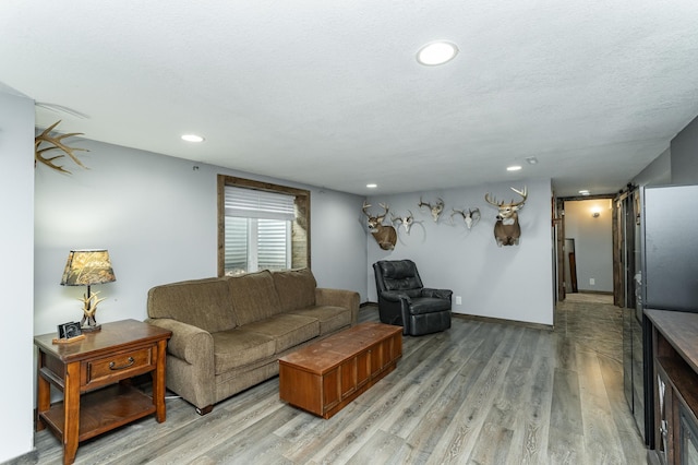 1000 17th St SW, Austin, MN 55912 - living area featuring light wood finished floors and recessed lighting