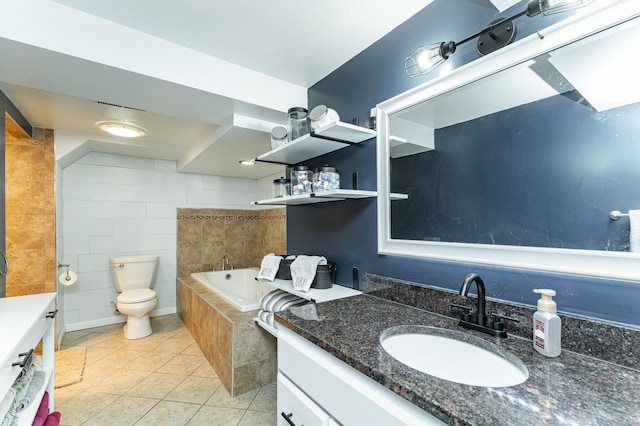 1000 17th St SW, Austin, MN 55912 - full bathroom with vanity, tile patterned floors, a garden tub, and toilet