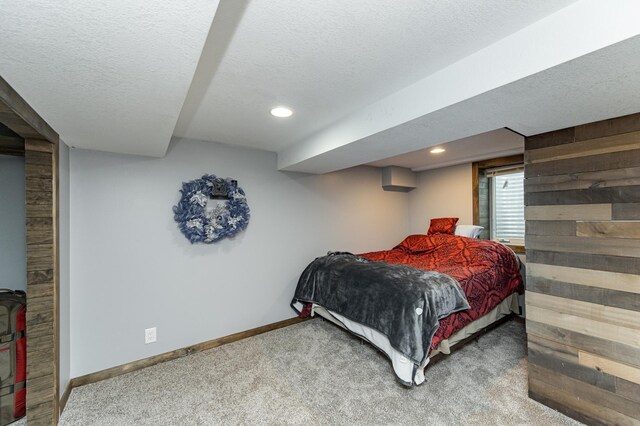 1000 17th St SW, Austin, MN 55912 - bedroom with carpet flooring, baseboards, a textured ceiling, and recessed lighting