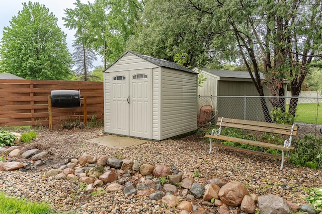 1000 17th St SW, Austin, MN 55912 - view of shed featuring a fenced backyard