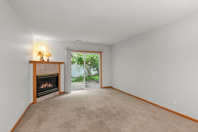 1022 17th Ave SE, Forest Lake, MN 55025 - unfurnished living room with a tiled fireplace, carpet, and baseboards