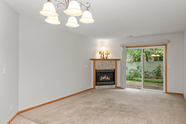 1022 17th Ave SE, Forest Lake, MN 55025 - unfurnished living room featuring carpet floors, a tile fireplace, a chandelier, and baseboards