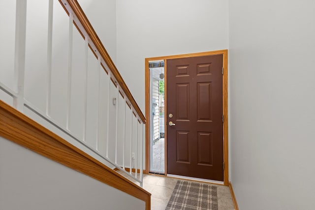 1022 17th Ave SE, Forest Lake, MN 55025 - tiled entrance foyer featuring stairs, baseboards, and a high ceiling
