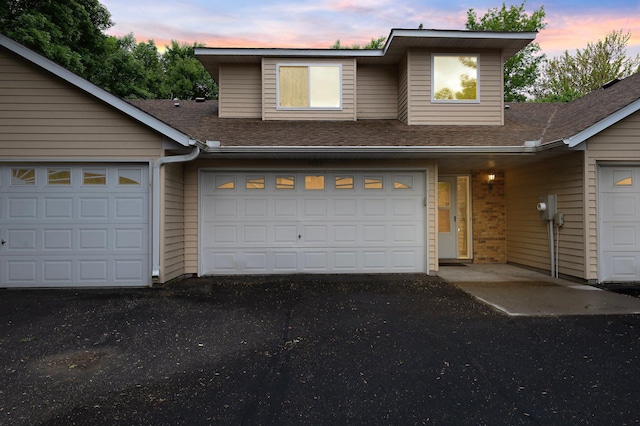 1022 17th Ave SE, Forest Lake, MN 55025 - view of front of property featuring a shingled roof and asphalt driveway