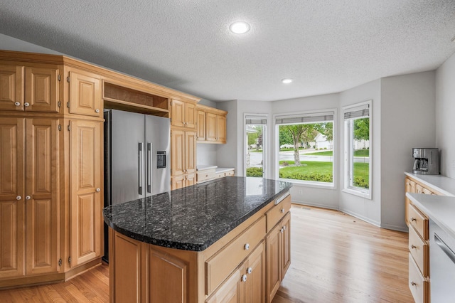 2600 Parkview Ct, White Bear Twp, MN 55110 - kitchen with appliances with stainless steel finishes, light wood finished floors, a textured ceiling, a center island, and open shelves