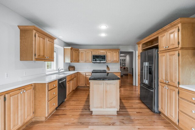 2600 Parkview Ct, White Bear Twp, MN 55110 - kitchen featuring stainless steel appliances, a sink, a kitchen island, light wood-type flooring, and recessed lighting