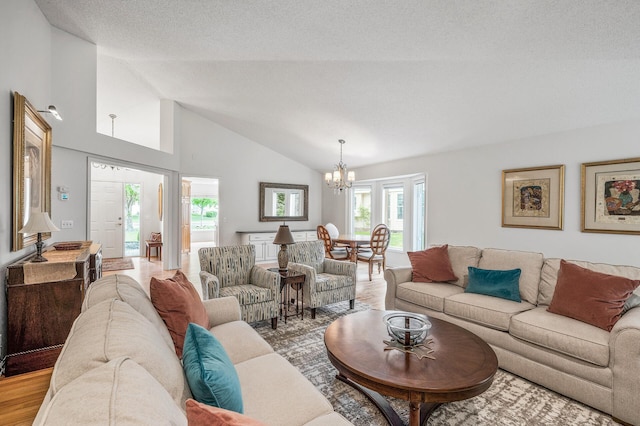2600 Parkview Ct, White Bear Twp, MN 55110 - living area with a chandelier, light wood-style flooring, and high vaulted ceiling