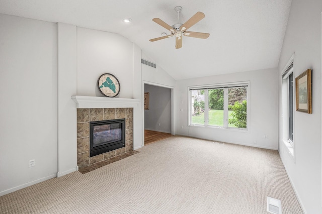 2600 Parkview Ct, White Bear Twp, MN 55110 - unfurnished living room featuring lofted ceiling, carpet floors, a tile fireplace, ceiling fan, and baseboards