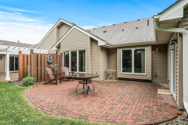 2600 Parkview Ct, White Bear Twp, MN 55110 - back of property with a pergola, roof with shingles, and a patio