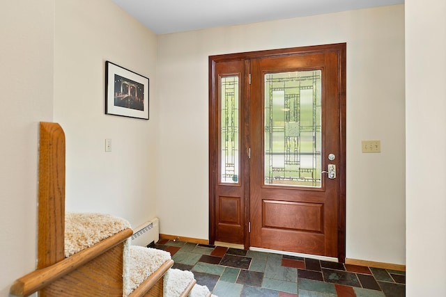6504 Warren Ave S, Edina, MN 55439 - entryway featuring baseboards, a baseboard heating unit, and stone tile flooring