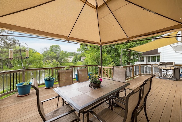 6504 Warren Ave S, Edina, MN 55439 - wooden deck featuring outdoor dining space, a gazebo, and a grill