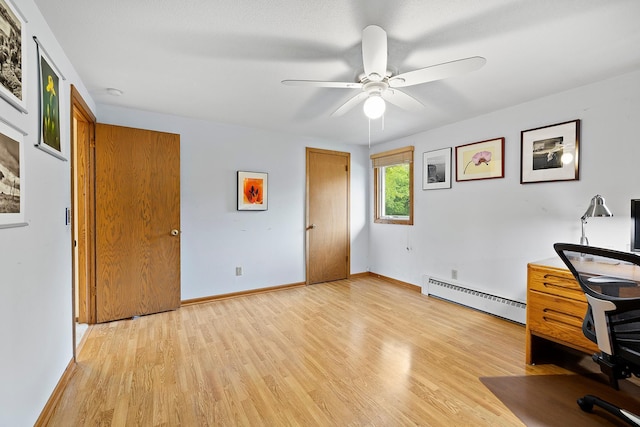 6504 Warren Ave S, Edina, MN 55439 - unfurnished office featuring a baseboard heating unit, light wood-type flooring, a ceiling fan, and baseboards