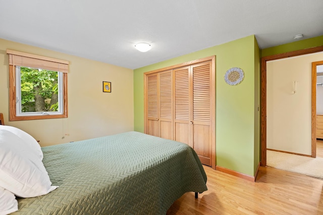 6504 Warren Ave S, Edina, MN 55439 - bedroom featuring a closet, light wood-type flooring, and baseboards