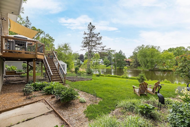 6504 Warren Ave S, Edina, MN 55439 - view of grassy yard with a deck with water view, stairway, and a garden