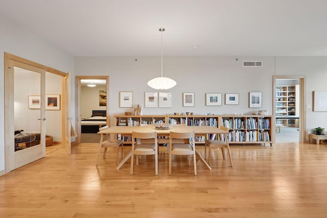 215 10th Ave S Unit 312, Minneapolis, MN 55415 - dining space with light wood-style floors