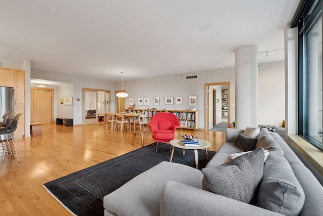 215 10th Ave S Unit 312, Minneapolis, MN 55415 - living room featuring light wood-style floors