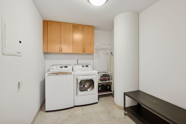 215 10th Ave S Unit 312, Minneapolis, MN 55415 - laundry area with cabinet space, electric panel, and washing machine and clothes dryer