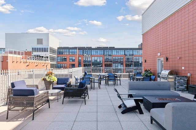 215 10th Ave S Unit 312, Minneapolis, MN 55415 - view of patio / terrace featuring an outdoor living space with a fire pit and outdoor dining space