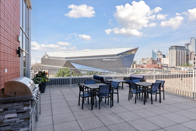 215 10th Ave S Unit 312, Minneapolis, MN 55415 - view of patio featuring outdoor dining area, area for grilling, and a view of city