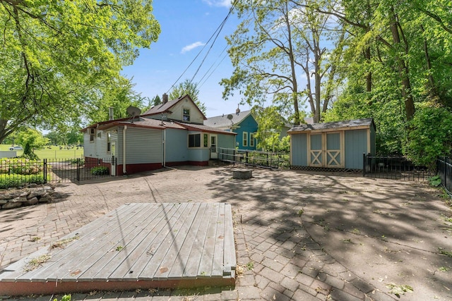 39 Magnolia Ave E, Saint Paul, MN 55117 - rear view of property with a fenced backyard and a patio