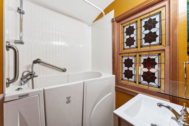 39 Magnolia Ave E, Saint Paul, MN 55117 - full bathroom featuring a sink and shower / washtub combination