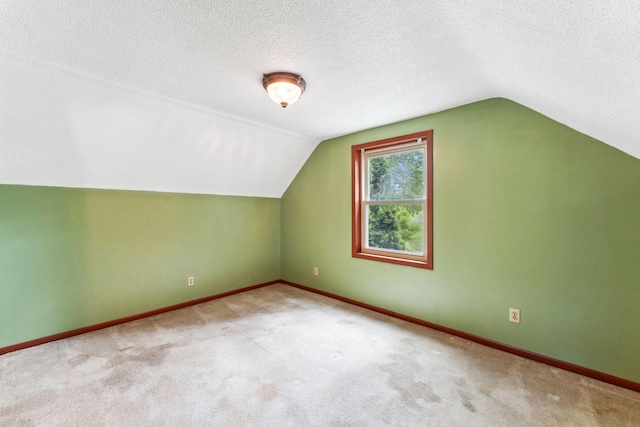 39 Magnolia Ave E, Saint Paul, MN 55117 - bonus room with vaulted ceiling, carpet flooring, a textured ceiling, and baseboards