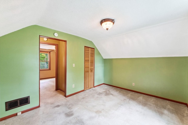 39 Magnolia Ave E, Saint Paul, MN 55117 - additional living space with lofted ceiling, carpet flooring, and baseboards