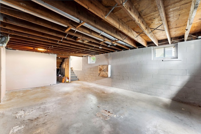 39 Magnolia Ave E, Saint Paul, MN 55117 - basement featuring stairway, concrete block wall, and plenty of natural light