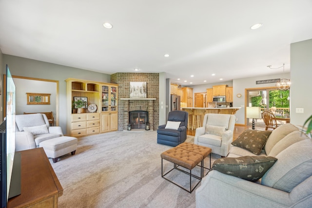14450 Blackberry Ct, Baxter, MN 56425 - living room with a fireplace, recessed lighting, light colored carpet, and a chandelier