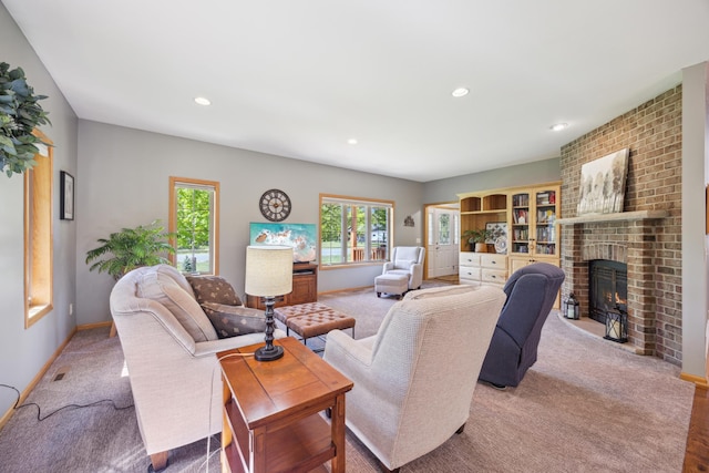14450 Blackberry Ct, Baxter, MN 56425 - living room featuring a fireplace, recessed lighting, light carpet, and baseboards