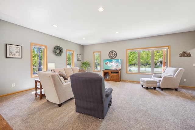 14450 Blackberry Ct, Baxter, MN 56425 - living area featuring healthy amount of natural light, light carpet, recessed lighting, and baseboards