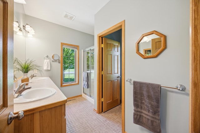 14450 Blackberry Ct, Baxter, MN 56425 - bathroom featuring double vanity, a shower stall, and baseboards