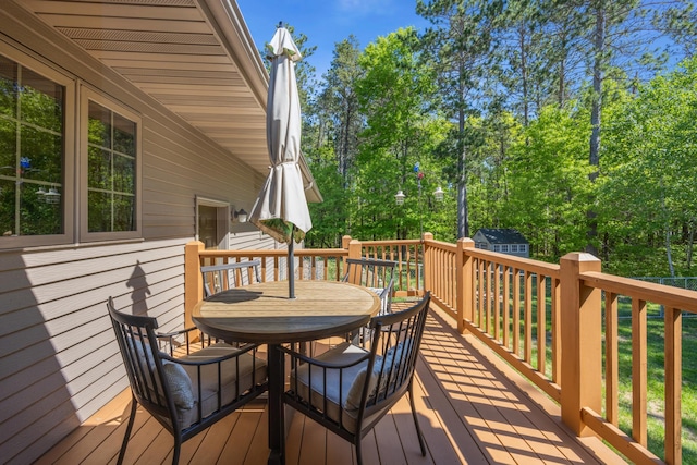 14450 Blackberry Ct, Baxter, MN 56425 - wooden terrace with outdoor dining space and grilling area
