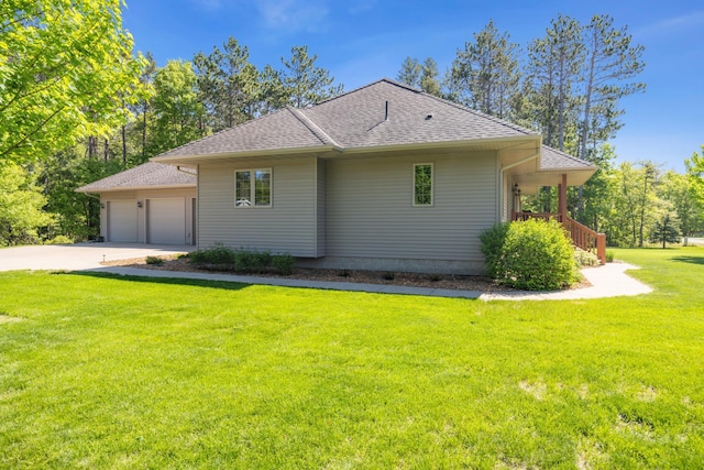 14450 Blackberry Ct, Baxter, MN 56425 - view of property exterior featuring a lawn, a garage, concrete driveway, and a shingled roof