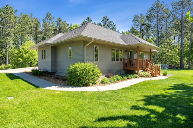 14450 Blackberry Ct, Baxter, MN 56425 - view of home's exterior with roof with shingles and a lawn