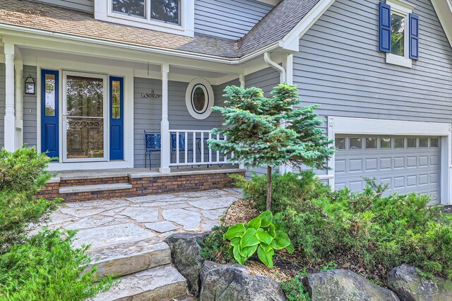 1321 Dallager Ct, Stillwater, MN 55082 - property entrance featuring a porch, an attached garage, and roof with shingles