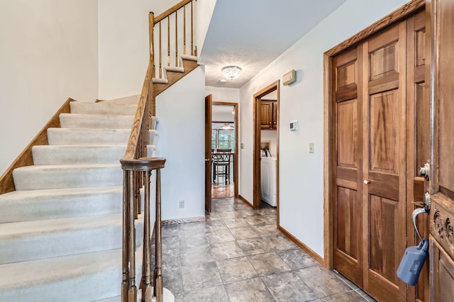 1321 Dallager Ct, Stillwater, MN 55082 - stairway with washer / dryer, baseboards, and stone finish flooring