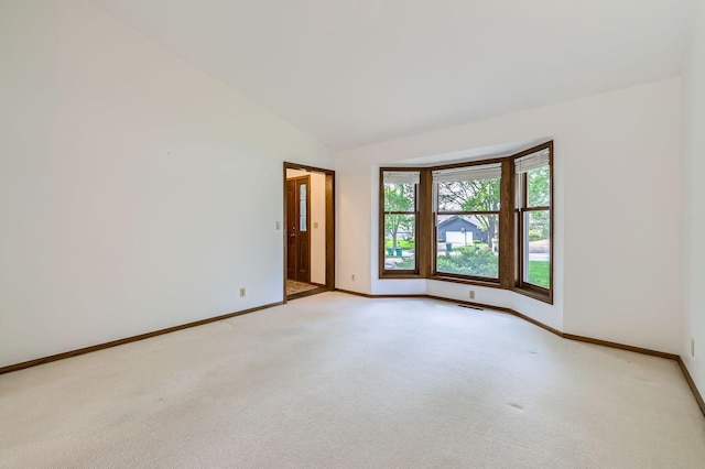 1321 Dallager Ct, Stillwater, MN 55082 - spare room featuring vaulted ceiling, baseboards, and light carpet