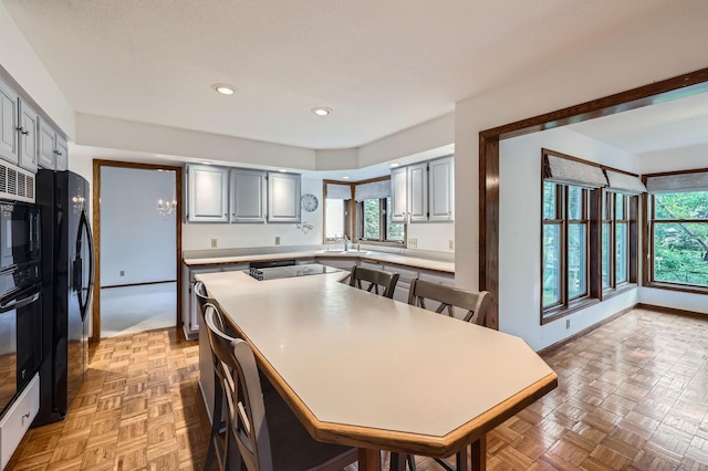 1321 Dallager Ct, Stillwater, MN 55082 - kitchen featuring a sink, light countertops, black appliances, gray cabinets, and recessed lighting
