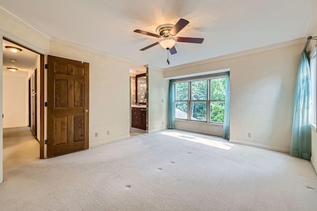 1321 Dallager Ct, Stillwater, MN 55082 - unfurnished bedroom with ornamental molding, carpet, baseboards, connected bathroom, and a ceiling fan