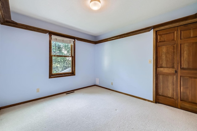 1321 Dallager Ct, Stillwater, MN 55082 - carpeted empty room with baseboards and crown molding