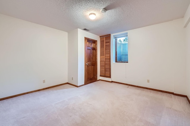 1321 Dallager Ct, Stillwater, MN 55082 - unfurnished bedroom featuring light carpet, a textured ceiling, baseboards, and a closet