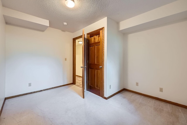 1321 Dallager Ct, Stillwater, MN 55082 - empty room with light colored carpet, baseboards, a textured ceiling, and a smoke detector
