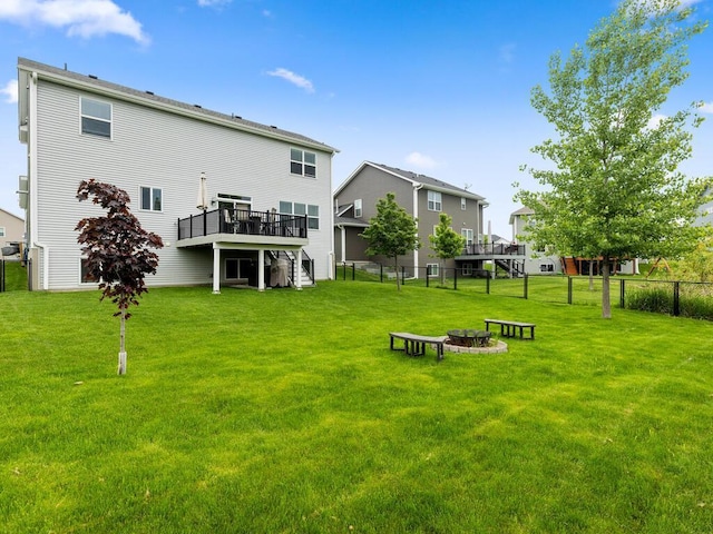 7121 208th St N, Forest Lake, MN 55025 - back of property with an outdoor fire pit and a wooden deck